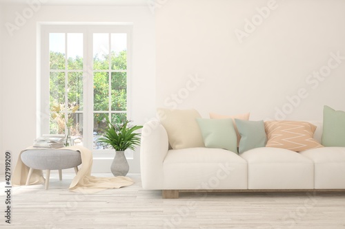 White living room with sofa and summer landscape in window. Scandinavian interior design. 3D illustration