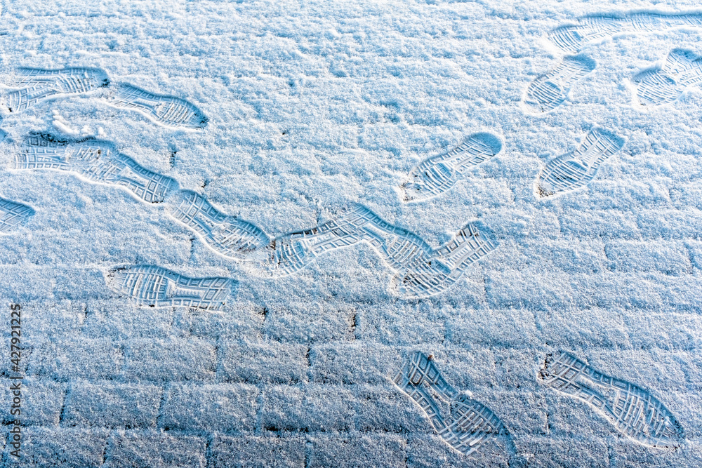 Lots of footprints in freshly fallen snow Lots of footprints in freshly fallen snow