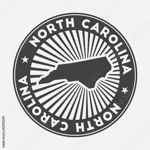 North Carolina round logo. Vintage travel badge with the circular name and map of US state, vector illustration. Can be used as insignia, logotype, label, sticker or badge of the North Carolina.