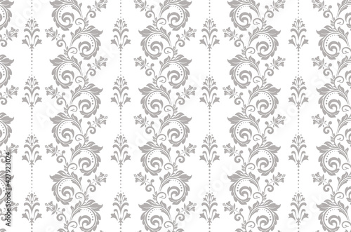 Wallpaper in the style of Baroque. Seamless vector background. White and gray floral ornament. Graphic pattern for fabric, wallpaper, packaging. Ornate Damask flower ornament.