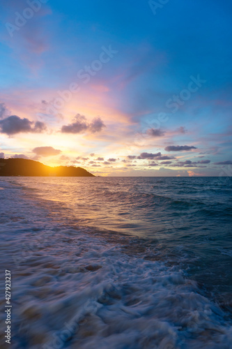 Summer time background beach  wave  sunset  cloud and blue sea as vertical image.