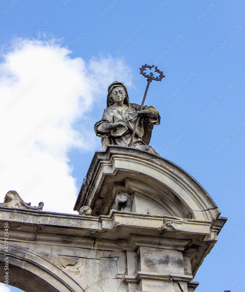 Virgin Mary queen of the world on a background of blue sky