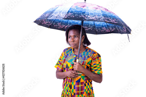 sad adult woman standing under an umbrella.
