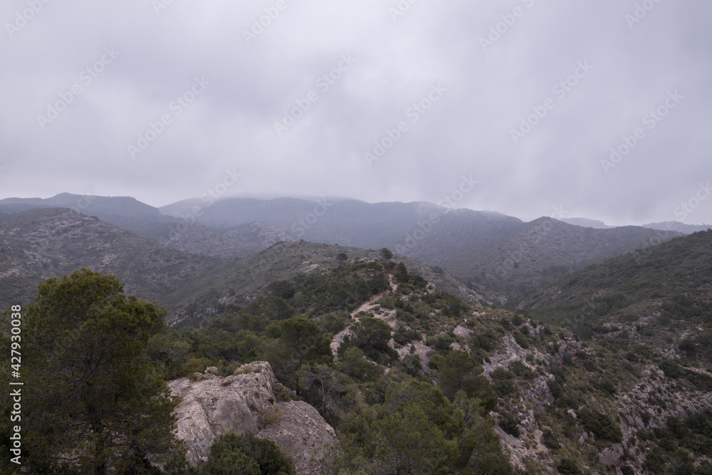 Landscape of mountains with mist and raining in autumn, captured from the top of the mountain