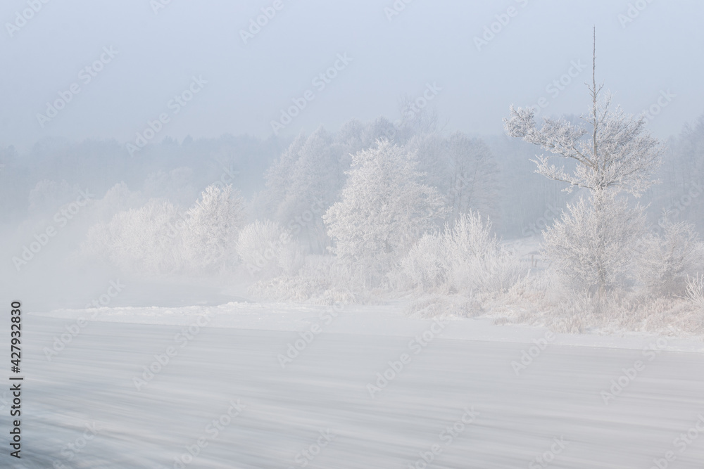 Winter morning by the river. Europe, Poland, the Pilica River. Floe, frost and rime. Winter morning by the river. Europe, Poland, the Pilica River. Floe, frost and rime.