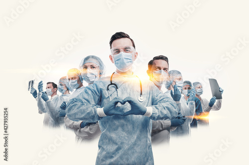 Obraz na płótnie medical workers heroes. a nurse in the foreground in a mask and uniform holds her hands in the shape of a heart. go to a lot of medical professionals. w salonie
