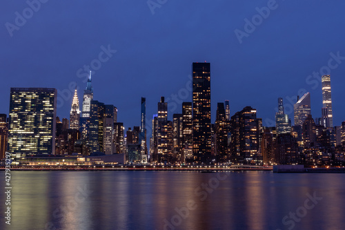 Nighttime Midtown Manhattan Skyline along the East River in New York City © James