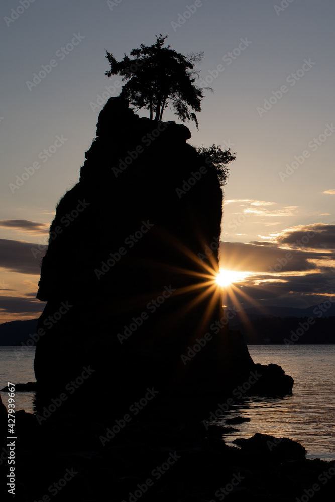Sunset behind Siwash rock in Stanley park Vancouver Canada