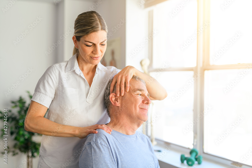 Fototapeta premium A Modern rehabilitation physiotherapy worker with senior client