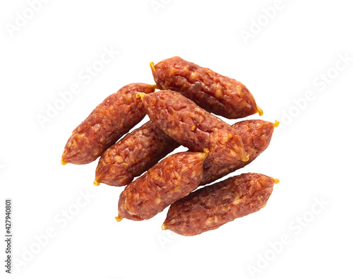 raw smoked mini sausages on a white background