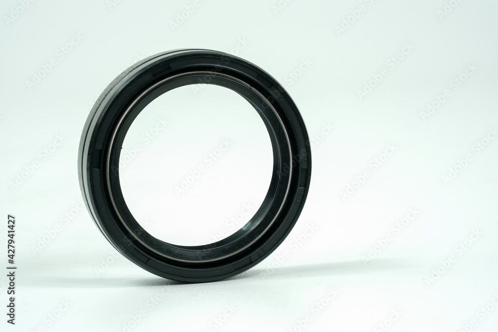 Spare part rubber seal for motorcycle fork.on a isolated white background. Motorcycle service. Spare part rubber seal for motorcycle fork.on a isolated white background. Motorcycle service.