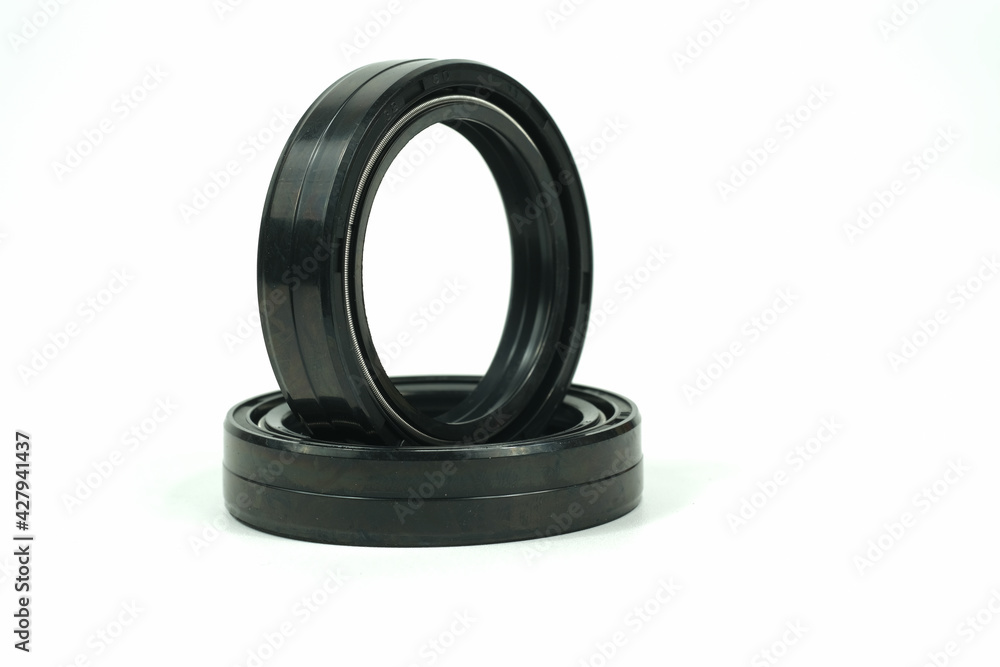 Spare part rubber seal for motorcycle fork.on a isolated white background. Motorcycle service. Spare part rubber seal for motorcycle fork.on a isolated white background. Motorcycle service.