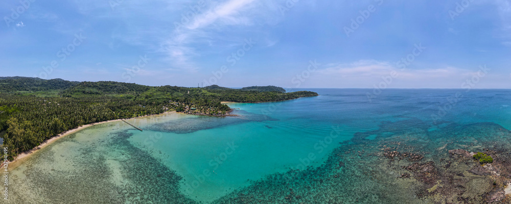 Fototapeta premium Aerial view of nature tropical paradise island beach enjoin a good summer beautiful time on the beach with clear water and blue sky in Koh kood or Ko Kut, Thailand.