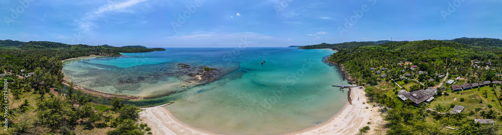 Fototapeta premium Aerial view of nature tropical paradise island beach enjoin a good summer beautiful time on the beach with clear water and blue sky in Koh kood or Ko Kut, Thailand.