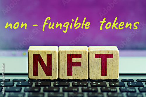 photo on nft (non-fungible token) theme. wooden cubes with the abbreviation 