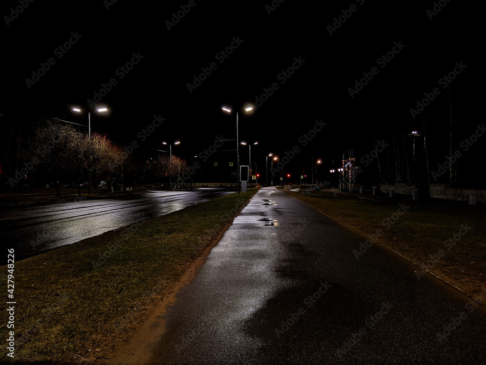 night illumination of empty streets in the city