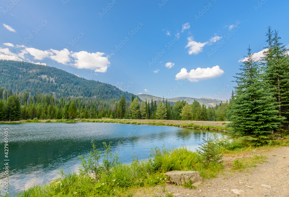 Majestic mountain lake in Canada. Lightning Lake in Manning Park in British Columbia. Lake Trail View. Majestic mountain lake in Canada. Lightning Lake in Manning Park in British Columbia. Lake Trail View.