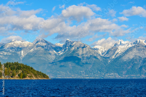Fantastic view over ocean  snow mountain and rocks at Sechelt inlet in Vancouver  Canada.