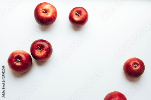 Ripe juicy red rayal gala apples on grey backgroung. Top view. Flat lay. photo