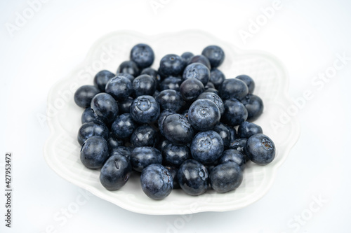 Group of fresh ripe blueberries on white background