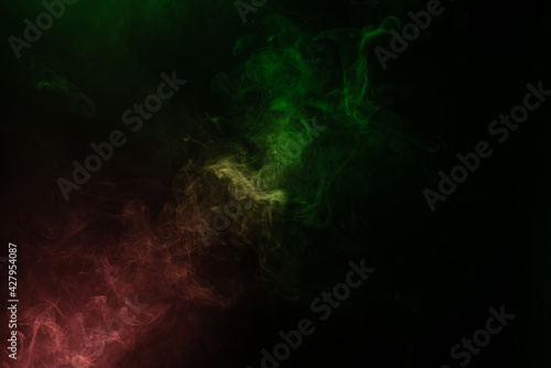 Green and pink steam on a black background.