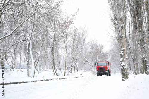 Modern fire truck on snowy country road