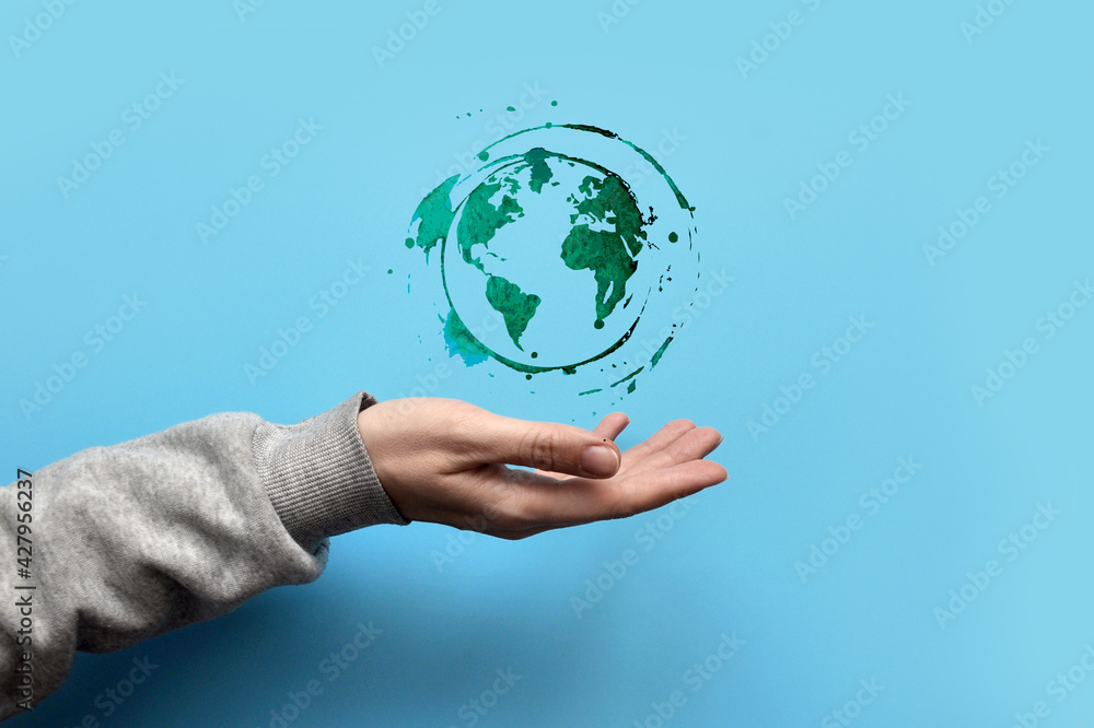 Drawing of the planet Earth in the hand of a person. Protecting and caring for planet Earth - obrazy, fototapety, plakaty 