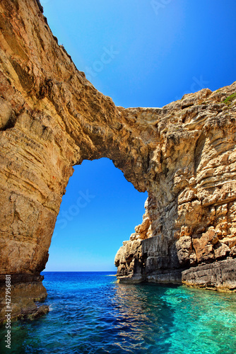 Trypitos (also known as "Kamara"), a natural rocky arch at Paxos ("Paxi") island, Ionian Sea, Eptanisa ("Seven Islands"), GREECE. Paxos island belongs to Kerkyra ("Corfu") prefecture. © Iraklis Milas