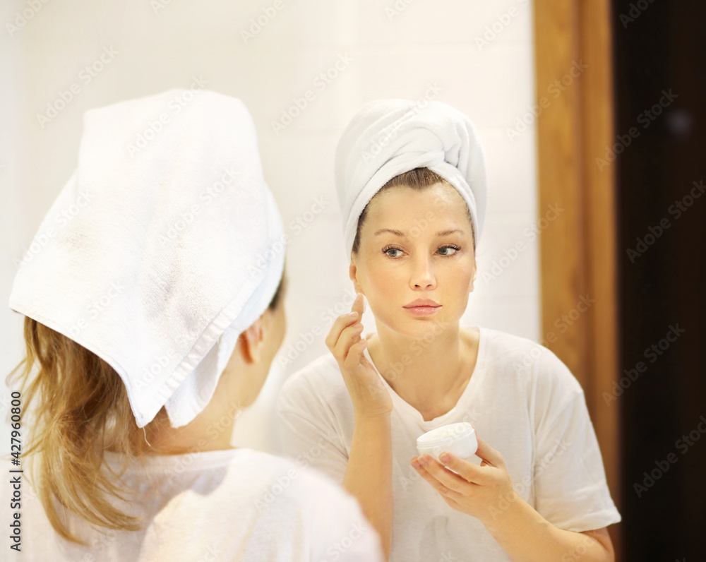 Magic anti-aging cream.Applying the cream. Magic anti-aging cream.Applying the cream.