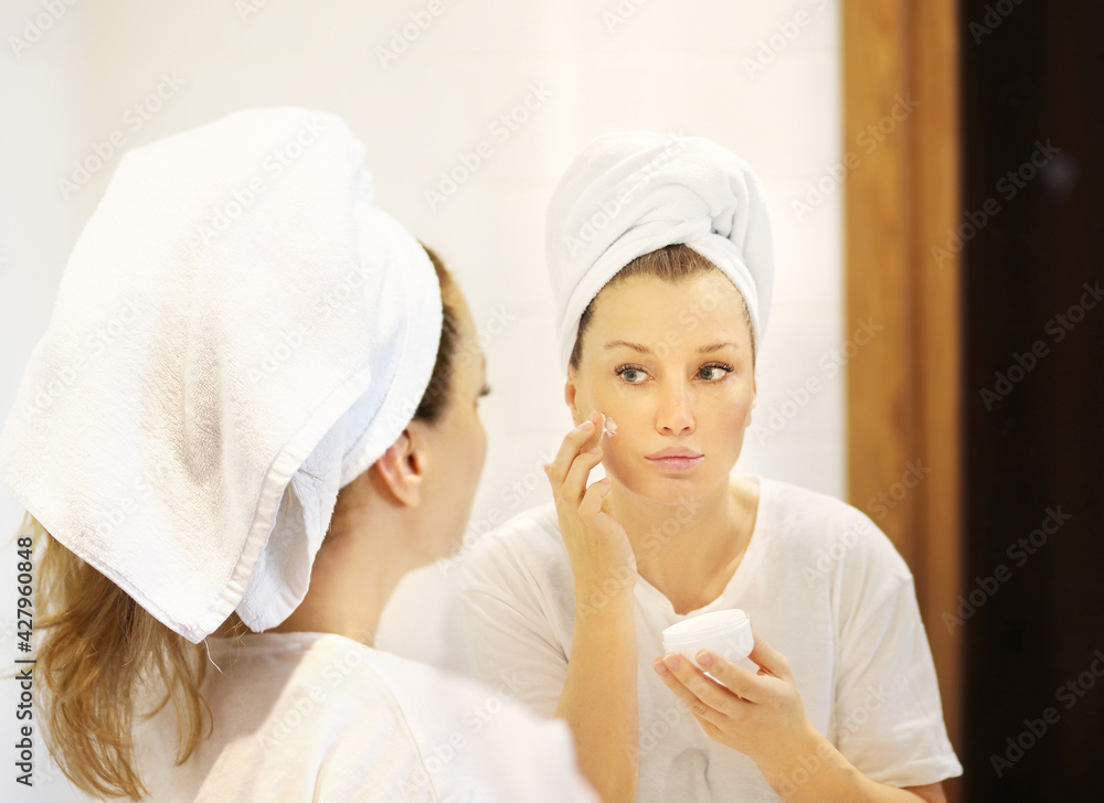 Magic anti-aging cream.Applying the cream. Magic anti-aging cream.Applying the cream.