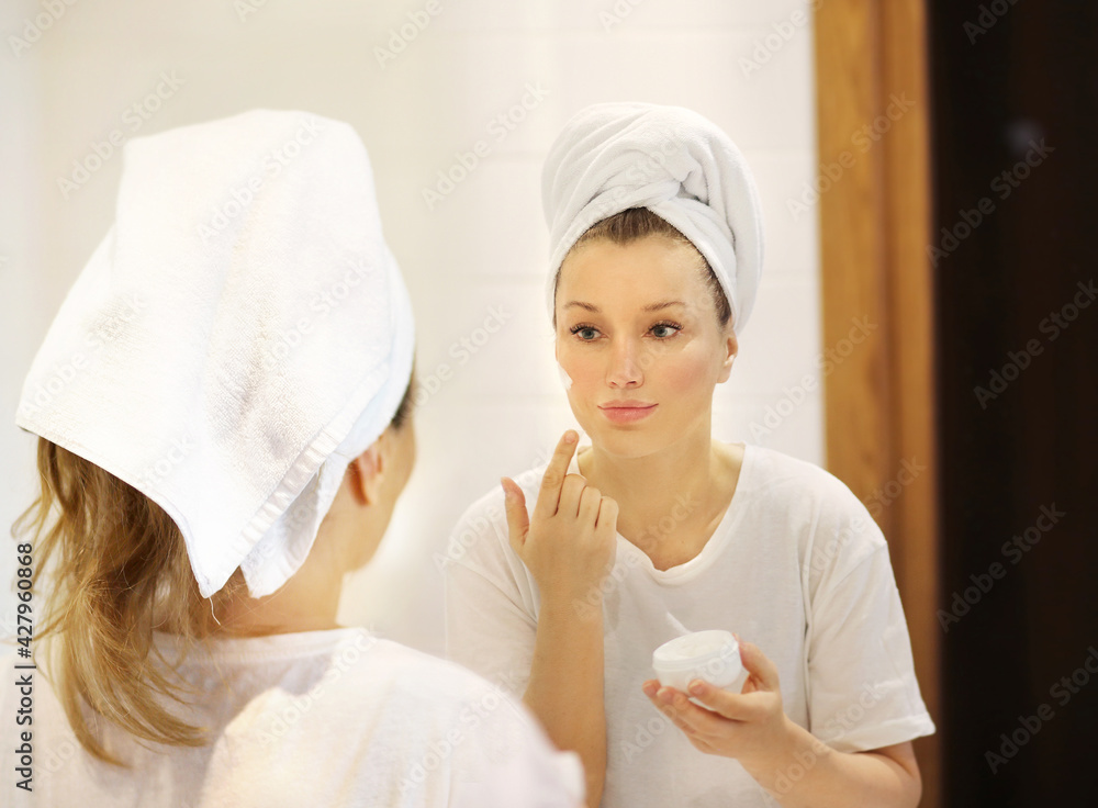 Magic anti-aging cream.Applying the cream. Magic anti-aging cream.Applying the cream.