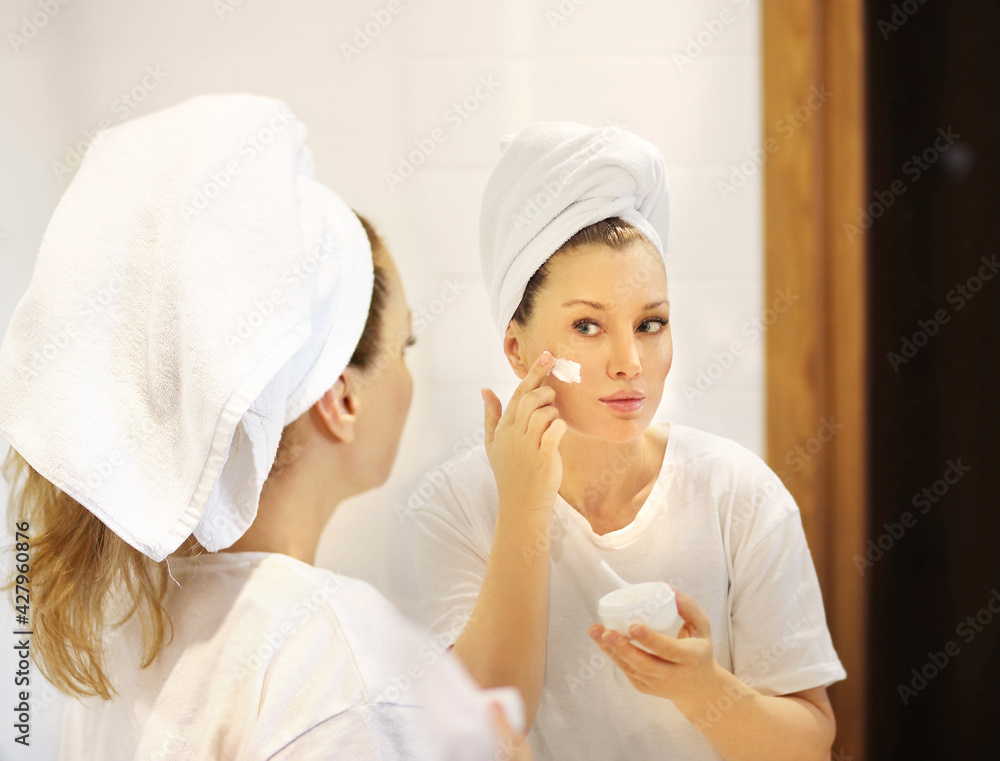 Magic anti-aging cream.Applying the cream. Magic anti-aging cream.Applying the cream.