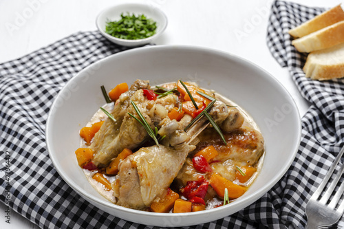 Homemade beer chicken stew with vegetables and aromatic herbs