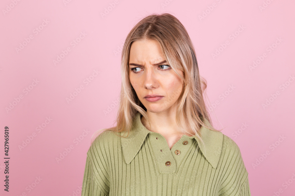 Pretty european woman in casual sweater on pink background suffering unhappy with gloomy expression needs support and help Pretty european woman in casual sweater on pink background suffering unhappy with gloomy expression needs support and help
