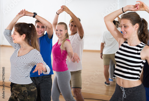 Portrait of young people dancing of partner dance at dance school.