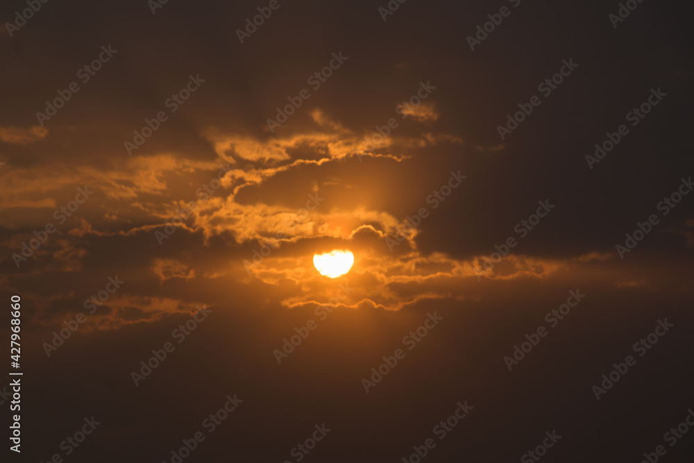 Panoramic landscape view of the beautiful sunrise or dawn with clouds shining with sunlight in Pune, Maharashtra, India