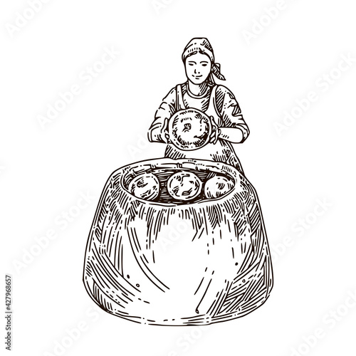 A woman bakes traditional bread in a tandoor. Sketch. Engraving style. Vector illustration.