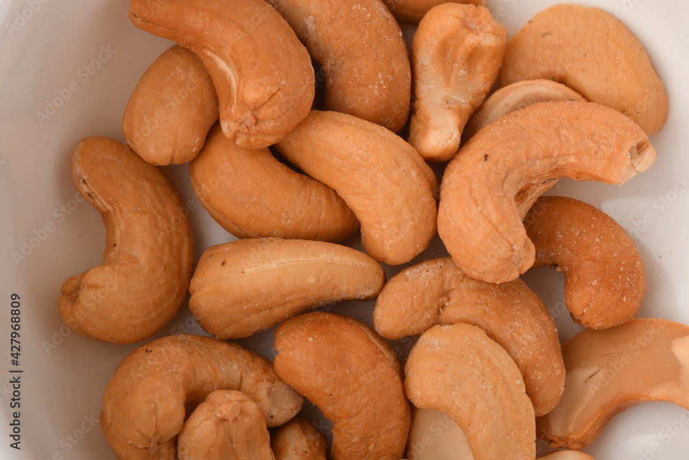 Heap of cashew nuts isolated on white background. Heap of cashew nuts isolated on white background.