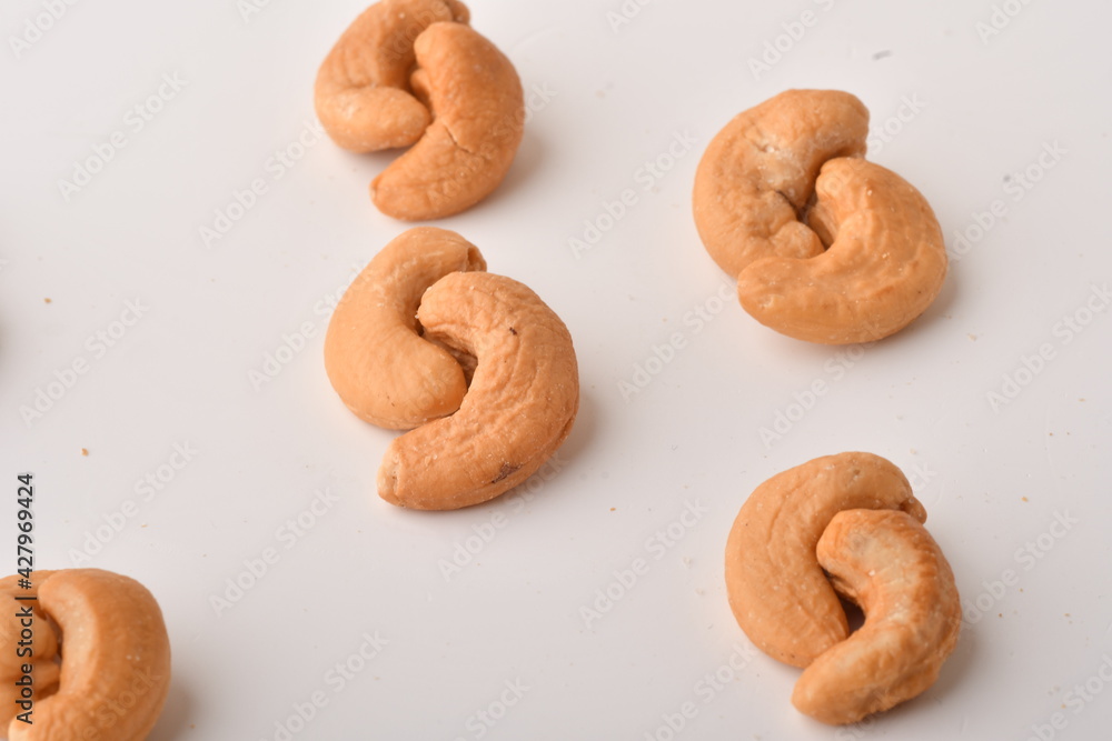 Heap of cashew nuts isolated on white background. Heap of cashew nuts isolated on white background.