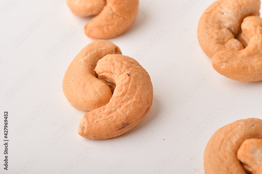 Heap of cashew nuts isolated on white background. Heap of cashew nuts isolated on white background.