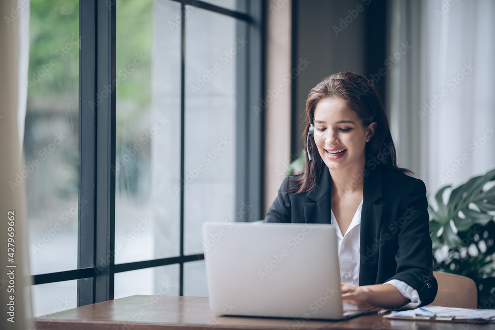 Female Work remotely via video conference on headphone Female Work remotely via video conference on headphone
