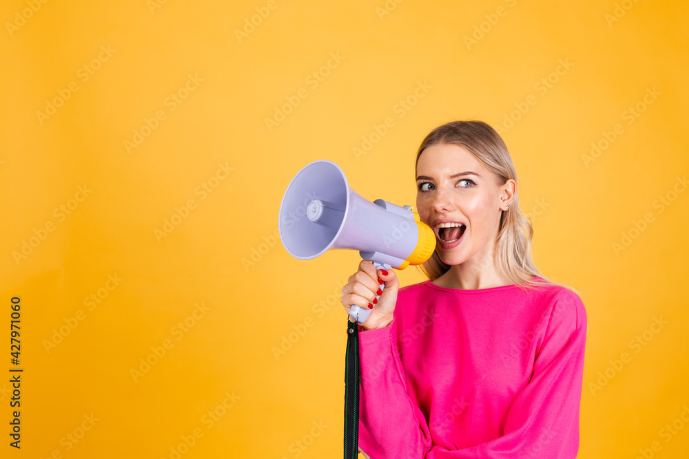 Pretty european woman in pink blouse on yellow background happy funny screaming in megaphone cheerful with big sweet smile excited amazed Pretty european woman in pink blouse on yellow background happy funny screaming in megaphone cheerful with big sweet smile excited amazed