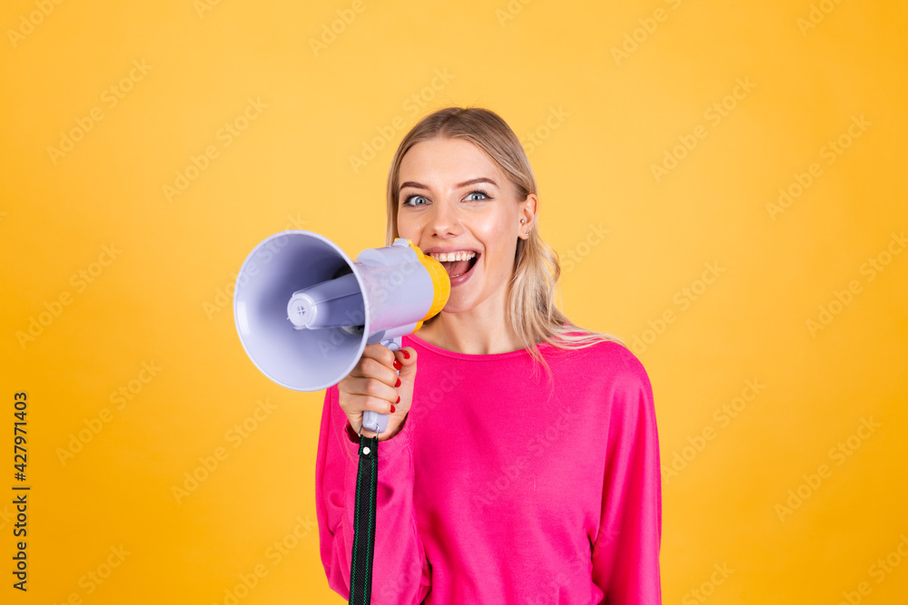 Pretty european woman in pink blouse on yellow background happy funny screaming in megaphone cheerful with big sweet smile excited amazed Pretty european woman in pink blouse on yellow background happy funny screaming in megaphone cheerful with big sweet smile excited amazed