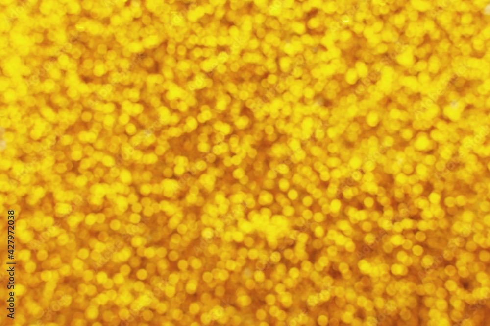 glittering background of golden sequins closeup. Sparkle festive texture glittering background of golden sequins closeup. Sparkle festive texture