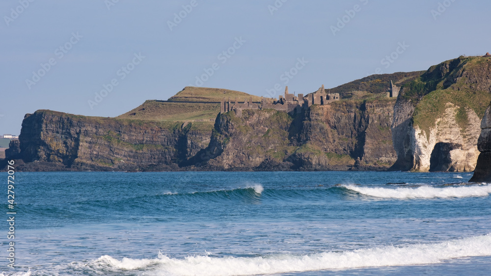 View of Dunluce Castle from White Rocks Beach, Northern Ireland, UK