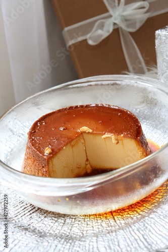caramel flan in a glass bowl close up
