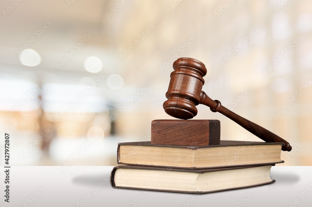 Justice books and wooden gavel on table. Justice concept Justice books and wooden gavel on table. Justice concept