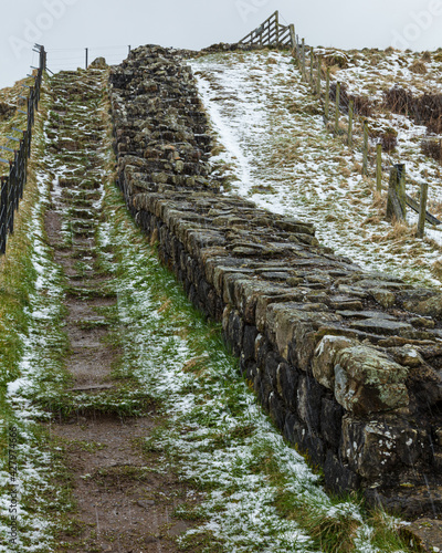 Winter landscape image of Cawfield Quarry and Crag on Hadrian's Wall. Roman Wall, in Northumberland, Engalnd, UK. photo