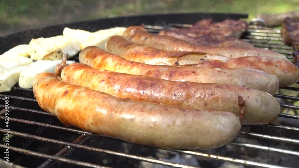 Slow Motion of Tasty German Sausages on Barbecue Grill in Thuringia Slow Motion of Tasty German Sausages on Barbecue Grill in Thuringia