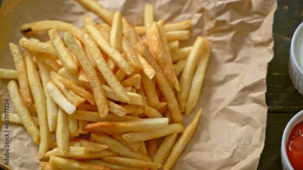 French fries or potato chips with sour cream and ketchup French fries or potato chips with sour cream and ketchup